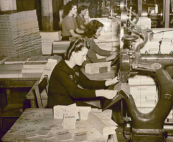 Women stapling ration books, 1943